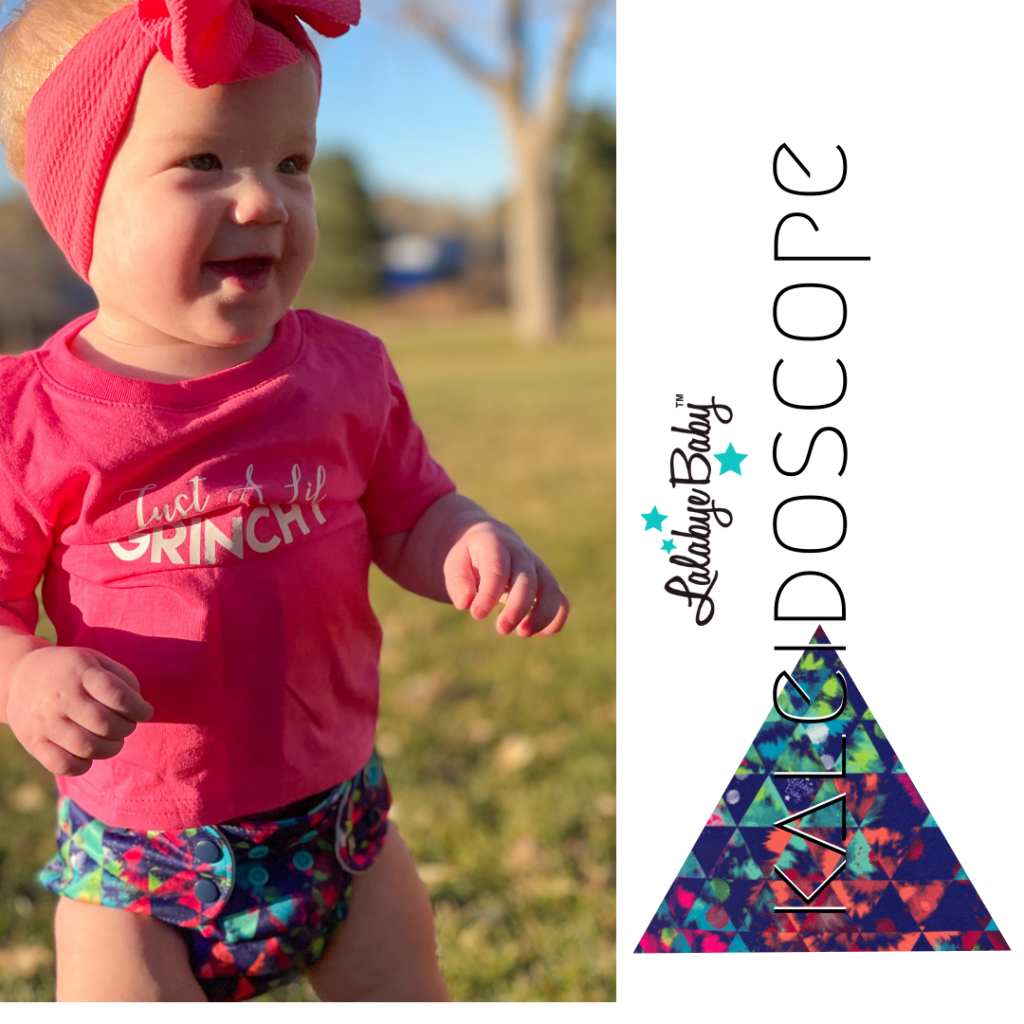 Graphic featuring on the right side: the nameplate of the design-the name Kaleidoscope written vertically in black ink and a triangle filled with the print design to the left of the name. On the left side of the graphic is an image of a caucasian toddler girl wearing a neon pink bow, tshirt, and a Kaleidoscope print one size diaper. She is smiling and in the midst of running with her hands outstretched by her side. 